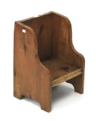 A vintage wooden child's chair.