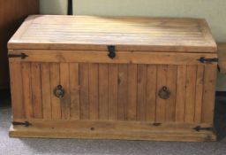 A pine plank metal bound trunk.