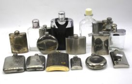 A large collection of hip flasks.