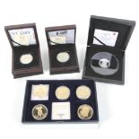 Selection of boxed proof coins.