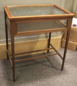 An Edwardian inlaid mahogany bijouterie display cabinet.