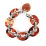 A Scottish agate and white metal bracelet. Of unusual form, unmarked. Weight 33.