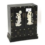 A Chinese mother of pearl inlaid jewellery cabinet.