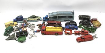An assortment of playworn diecast and model soldiers.