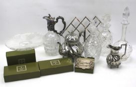 An assortment of glass decanters, silver plate and metalware.