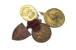 Four unusual pilgrim medals.