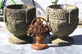 A pair of small reconstituted stone garden plant pots and a cast iron door stop by Midwest