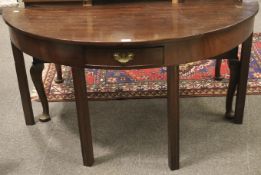 A 19th century mahogany demi-lune table.