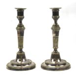 A pair of 19th century Sheffield plate candlesticks.