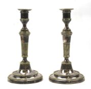 A pair of 19th century Sheffield plate candlesticks.