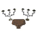 A vintage Sunlight Soap cast iron wall sign and two three sconce candelabra.