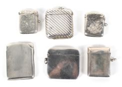 Six silver and white metal vesta cases.