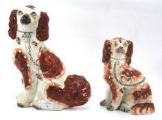 Two 19th century Staffordshire King Charles Spaniels.