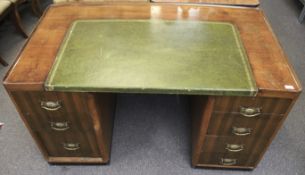 A retro style mahogany kneehole desk.