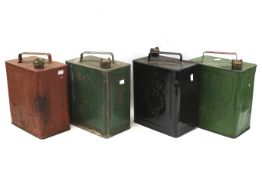 Four assorted vintage petrol cans.