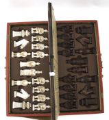 A 20th century oriental cased travelling chess set.