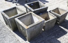 Five tapering square section stone plant pots.