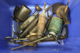 An assortment of motoring oil cans and tools.