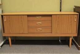 A 1970s veneered sideboard.