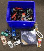 A box of playworn die cast vehicles.