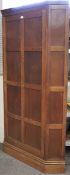 An early 20th century oak corner wardrobe.