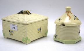 Two Crown Devon honey pots.