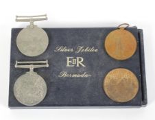 A WWI Victory medal and two WWII medals.