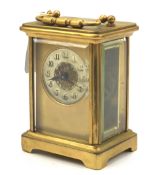 A brass carriage clock.