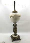 A 20th century gilt metal and porcelain table lamp.