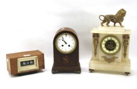 Three assorted mantel clocks.