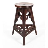 A mahogany Liberty style Arts and Crafts stool.