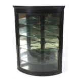 An ebonised glazed corner display cabinet, late 19th/early 20th century.