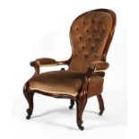 A Victorian mahogany framed spoon button back open armchair.