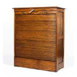 An early 20th century oak tambour cabinet.