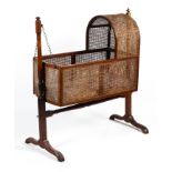 A Victorian cane work babies swing cradle.