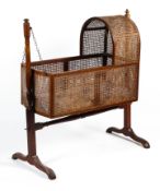 A Victorian cane work babies swing cradle.