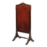 A Victorian stained pine rising fire screen.