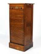 A 1930s oak tambour fronted filing cabinet.