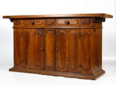 A 19th century French fruitwood sideboard of large proportion.