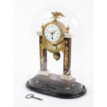 A French Empire style gilt metal and marble mounted mantel clock.