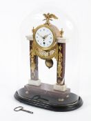 A French Empire style gilt metal and marble mounted mantel clock.
