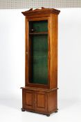 An Edwardian glazed mahogany gun cabinet.