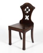 An early 20th century oak hall chair.