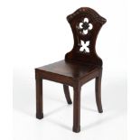 An early 20th century oak hall chair.