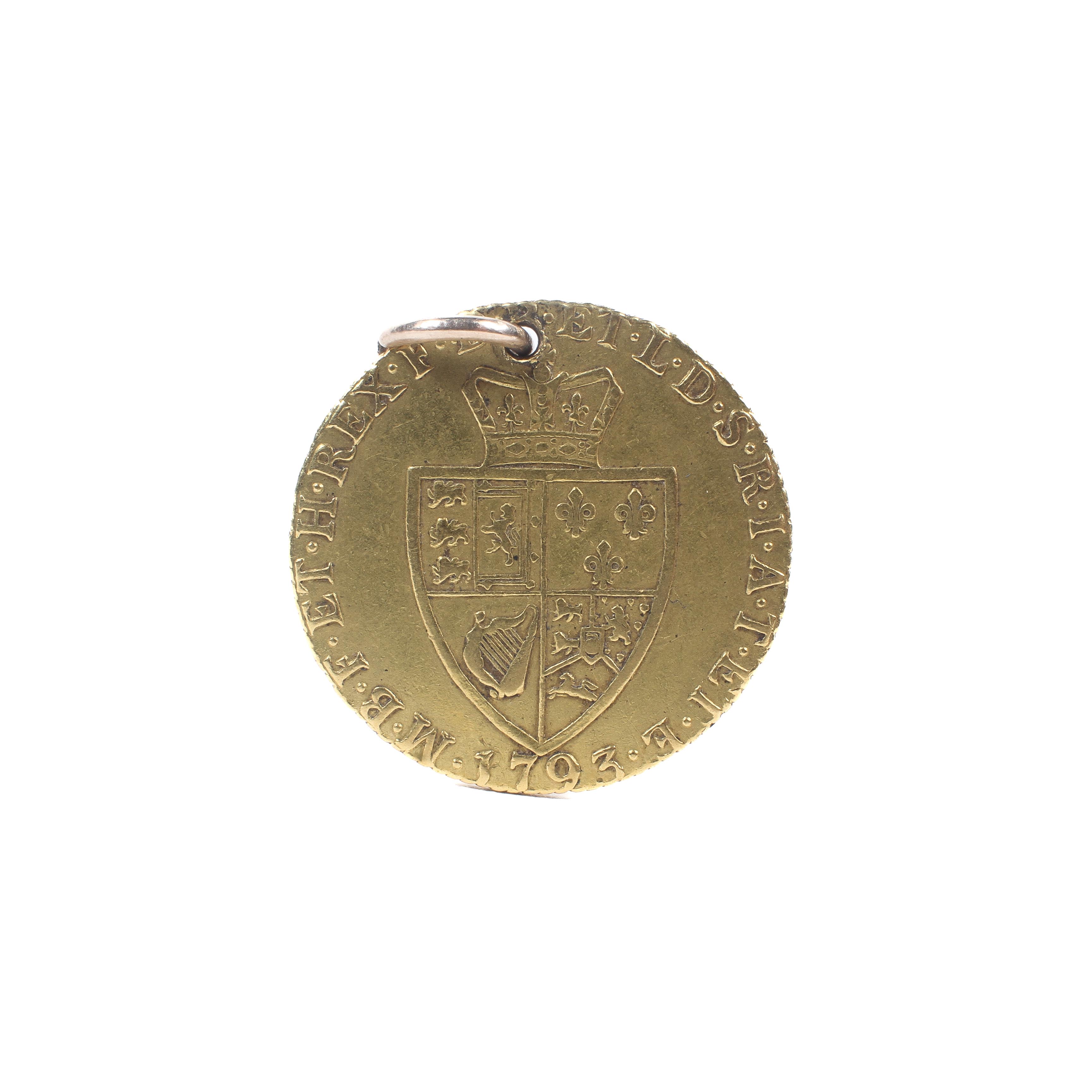 A George III full guinea, dated 1793. With pendant loop hole. Weight approximately 8. - Image 2 of 2