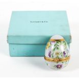 A Tiffany & Co gilt-metal mounted porcelain egg.