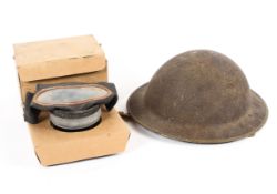 A mid-century military helmet and a gas mask.