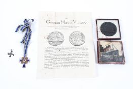 A WWII German Third Reich enamel 'Der Deutschen Mutter' mothers medal and other items.