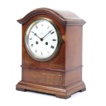 An Edwardian mahogany brass inlaid bracket clock. The white enamelled named for A.
