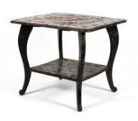 An early 20th century ebonised heavily carved side table of Japanese influence.